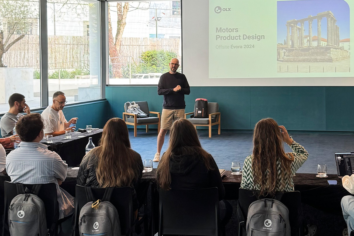 Victor standing up, presenting a keynote to his team.